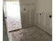 An unfinished room shows an open doorway and concrete flooring at 2379 Broadbrook Drive, St Cloud, FL 34771