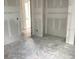 Open space with drywall, concrete flooring, and doorway at 2379 Broadbrook Drive, St Cloud, FL 34771