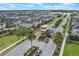 Aerial view featuring a gated entrance and lush landscaping in a well-planned community at 2696 Giardino Loop, Kissimmee, FL 34741