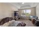 Bright bedroom with a large window, neutral walls, and plenty of space for storage at 2696 Giardino Loop, Kissimmee, FL 34741