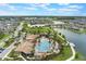 Beautiful aerial shot of a community pool, clubhouse, and lake in a residential area at 2696 Giardino Loop, Kissimmee, FL 34741