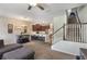 Open-concept living area showcasing a modern kitchen, dining space, and staircase at 2696 Giardino Loop, Kissimmee, FL 34741