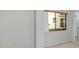 Neutral-toned bedroom with a window offering natural light and outdoor views at 300 Carolina Ave # 205, Winter Park, FL 32789