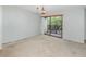 Open dining area with sliding glass doors leading to a private balcony at 300 Carolina Ave # 205, Winter Park, FL 32789