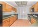 Functional kitchen featuring wood cabinets and essential appliances at 300 Carolina Ave # 205, Winter Park, FL 32789