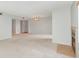 Bright and spacious living area with a fireplace and neutral carpeting at 300 Carolina Ave # 205, Winter Park, FL 32789