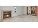 Cozy living room with a fireplace and sliding doors to an outdoor space at 300 Carolina Ave # 205, Winter Park, FL 32789
