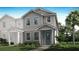 Charming two-story home with a blue front door and inviting, landscaped yard at 3073 Douglas Fir Dr, Apopka, FL 32703