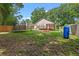 This spacious backyard features a trampoline and lush greenery, providing a fun and relaxing outdoor space at 30926 County Road 435, Sorrento, FL 32776
