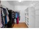 Walk-in closet with metal shelving and hanging rods, and a safe at 30926 County Road 435, Sorrento, FL 32776