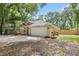 Charming single-story home featuring a two-car garage and a well-maintained lawn with trees and shrubs at 30926 County Road 435, Sorrento, FL 32776
