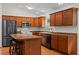 Spacious kitchen with hardwood floors, wooden cabinets, and a center island at 30926 County Road 435, Sorrento, FL 32776