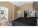Main bedroom with ensuite bathroom, walk-in closet, and wood flooring at 30926 County Road 435, Sorrento, FL 32776