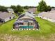 Aerial view of the backyard and the screened pool at 318 Langham Dr, Davenport, FL 33897