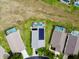 Aerial shot of a well-maintained property with a pool and a neatly landscaped backyard in a quiet neighborhood at 318 Langham Dr, Davenport, FL 33897