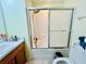 Bathroom featuring a tile shower, tile floors, and a single sink vanity at 318 Langham Dr, Davenport, FL 33897