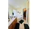 Clean bathroom with a large soaker tub and walk-in shower, next to a walk in closet at 318 Langham Dr, Davenport, FL 33897