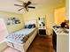 Bedroom featuring laminate floors, a ceiling fan, and generous closet space at 318 Langham Dr, Davenport, FL 33897