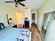 Bedroom featuring laminate floors, a ceiling fan, and neutral paint at 318 Langham Dr, Davenport, FL 33897