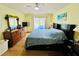 Sunny bedroom with a large window and view of pool, complemented by stylish decor at 318 Langham Dr, Davenport, FL 33897
