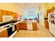 Functional kitchen with ample counter space, appliances, and bright tile flooring at 318 Langham Dr, Davenport, FL 33897