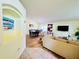 Inviting living room and dining area with a view of a large flat screen TV at 318 Langham Dr, Davenport, FL 33897