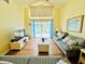 Spacious living room featuring laminate floors and a view of the pool at 318 Langham Dr, Davenport, FL 33897