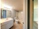 Well-lit bathroom features a tub-shower combo, vanity, and tiled floor, perfect for relaxation and daily routines at 3748 Idlebrook Cir # 202, Casselberry, FL 32707