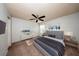 Staged bedroom with ceiling fan, and updated flooring, creating a modern and inviting space at 3748 Idlebrook Cir # 202, Casselberry, FL 32707