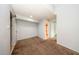 A cozy bedroom boasts neutral walls, plush carpet, and an ensuite bathroom for added privacy and convenience at 3748 Idlebrook Cir # 202, Casselberry, FL 32707