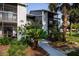 Exterior view of the condominium building showcasing well-maintained landscaping and easy access to units at 3748 Idlebrook Cir # 202, Casselberry, FL 32707