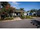 Attractive entrance with lush landscaping and covered walkway, creating a welcoming and scenic community ambiance at 3748 Idlebrook Cir # 202, Casselberry, FL 32707