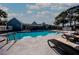 Stunning outdoor pool with comfortable lounge seating, ideal for relaxation and socializing with neighbors at 3748 Idlebrook Cir # 202, Casselberry, FL 32707