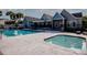 Inviting community pool and spa surrounded by comfortable lounging areas, ideal for relaxation and socializing at 3748 Idlebrook Cir # 202, Casselberry, FL 32707