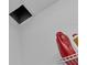 Attic access with a small shelf and cleaning supplies at 391 Cabello Dr, Davenport, FL 33837