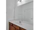 Bathroom featuring a large mirror, vanity with cabinet and a single sink at 391 Cabello Dr, Davenport, FL 33837