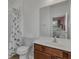 Bathroom with a single sink vanity, shower-tub combination and a view of the bedroom at 391 Cabello Dr, Davenport, FL 33837