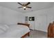 Bedroom featuring a full bed, ceiling fan, closet and dresser with a television at 391 Cabello Dr, Davenport, FL 33837