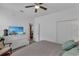 Bedroom featuring a comfortable queen bed, ceiling fan and dresser with a television at 391 Cabello Dr, Davenport, FL 33837