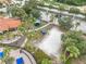 Aerial view of the community amenities with a sand volleyball court, picnic pavilion, and playground at 391 Cabello Dr, Davenport, FL 33837