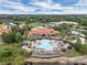 Aerial view highlighting the community center, pool, hot tub, and lush surrounding landscape at 391 Cabello Dr, Davenport, FL 33837