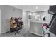 Game room featuring two classic arcade games and comfortable seating, ideal for entertainment at 391 Cabello Dr, Davenport, FL 33837