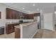 Modern kitchen features granite countertops, stainless steel appliances, and dark wood cabinetry at 391 Cabello Dr, Davenport, FL 33837