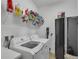 Functional laundry room with modern appliances and storage shelves at 391 Cabello Dr, Davenport, FL 33837