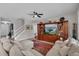 Bright living room with a staircase and large sofa at 391 Cabello Dr, Davenport, FL 33837