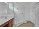 Glass enclosed walk-in shower with tiled walls and floor, and a single sink vanity at 391 Cabello Dr, Davenport, FL 33837