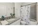 Bathroom featuring a granite vanity and shower/tub combination at 394 Quayside Ave, Mascotte, FL 34753