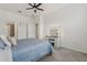 Bright bedroom with a ceiling fan and a vanity area at 394 Quayside Ave, Mascotte, FL 34753