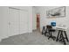 Bedroom featuring a desk and access to the bathroom at 394 Quayside Ave, Mascotte, FL 34753