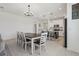 An open-concept design connecting the kitchen, dining, and living areas at 394 Quayside Ave, Mascotte, FL 34753